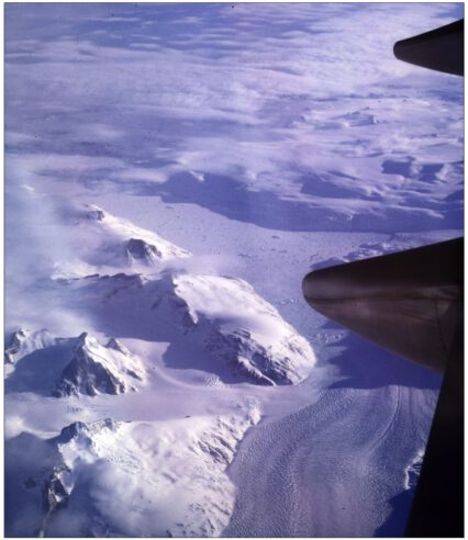 an aerial view of snowy mountains